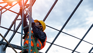 Construction Worker Climbing Ladder